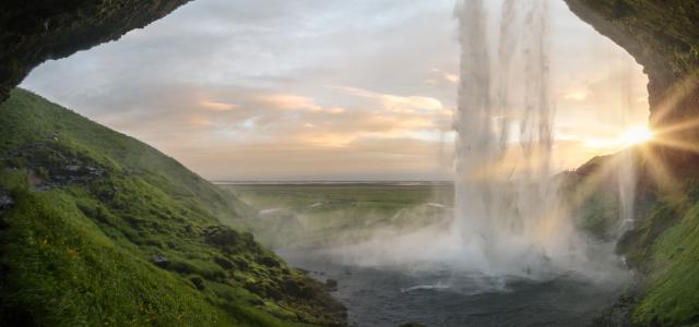 waterfalls near cave at daytime by Joshua Sortino courtesy of Unsplash.